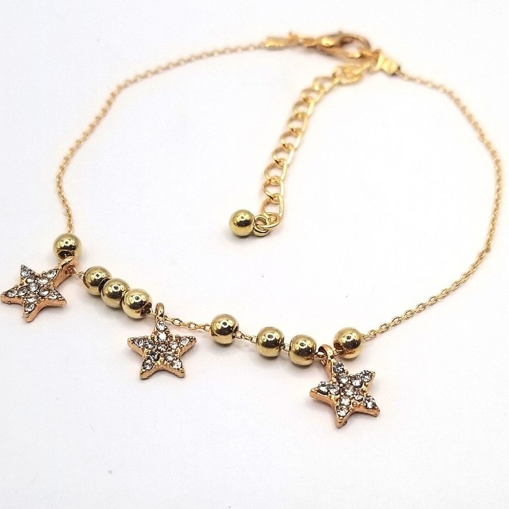 Gold toned chain star rhinestone charm ankle bracelet.